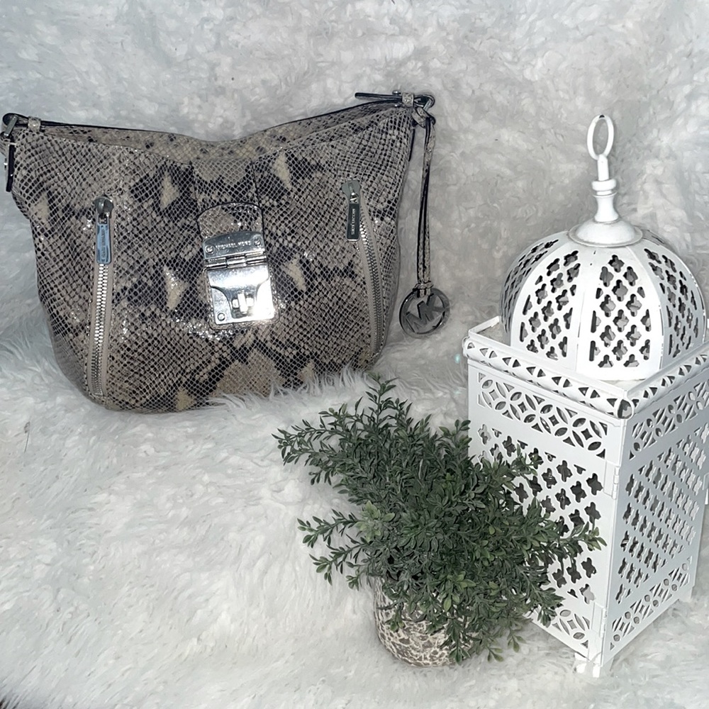 Snake print Michale Kors purse with silver accents
